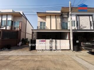 Modern two-story residential house with gated entrance