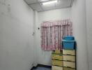 Narrow hallway with decorative ceiling and storage units