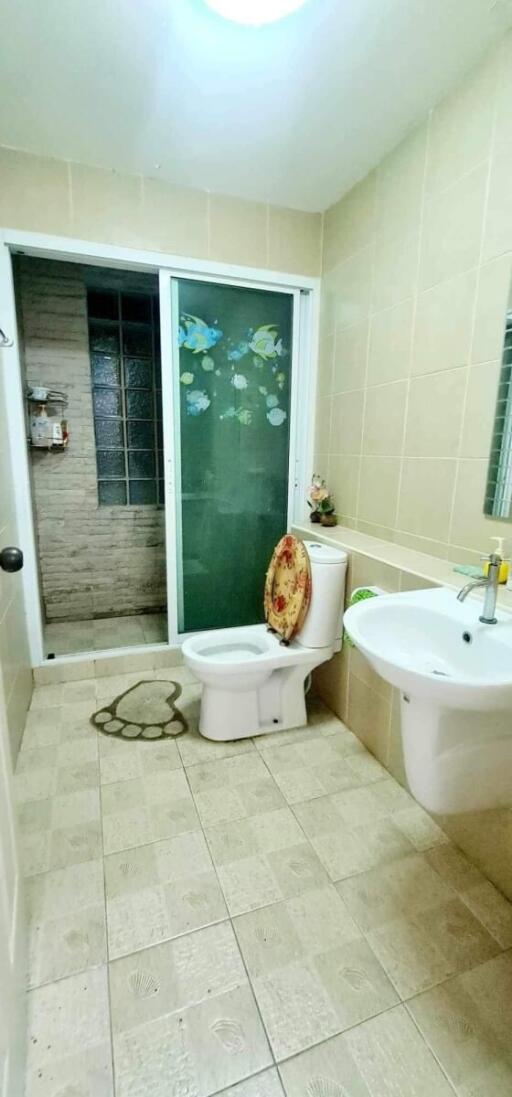 Spacious bathroom with modern amenities and artistic decor