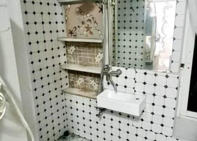 Modern bathroom with black and white tile design