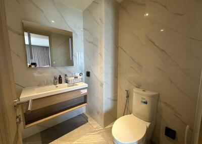 Elegant bathroom with modern fixtures and marble tiling