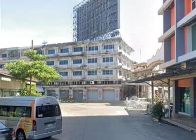 Urban street with commercial buildings and modern architecture in the background