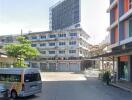 Urban street with commercial buildings and modern architecture in the background