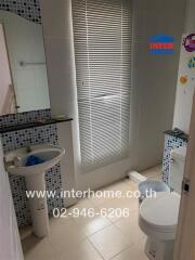 Bright and tidy bathroom with modern amenities