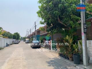 Residential street view with houses and parked cars