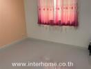 Spacious and bright empty bedroom with pink curtains