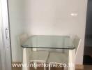Modern small kitchen with glass dining table and two chairs