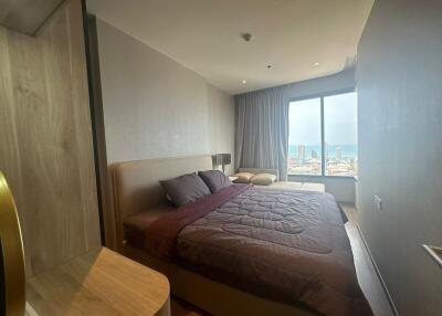 Modern bedroom with ocean view and ample natural light