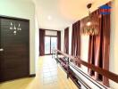 Elegant hallway with sophisticated lighting and warm curtains