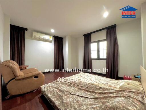 Spacious bedroom with comfortable furnishings