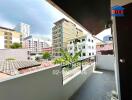 Spacious balcony with city view and potted plant