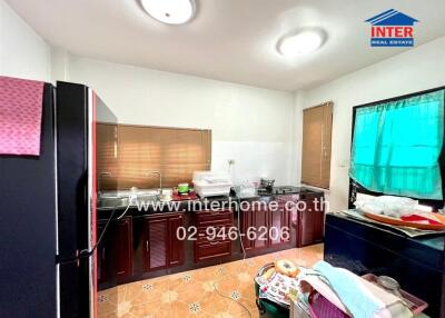 Spacious kitchen with large windows and ample counter space