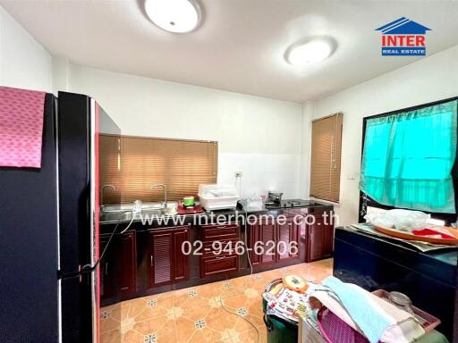 Spacious kitchen with large windows and ample counter space
