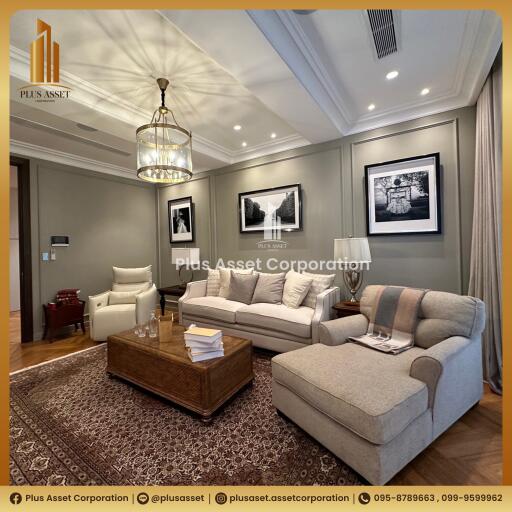 Elegant and spacious living room with modern furnishings and decorative lighting