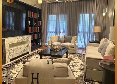 Elegant and spacious living room with luxurious furnishings and decor