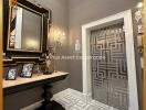 Elegant foyer with decorative mirror and wall patterns