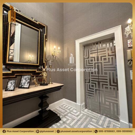 Elegant foyer with decorative mirror and wall patterns