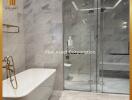 Luxurious modern bathroom with a freestanding bathtub and glass shower enclosure