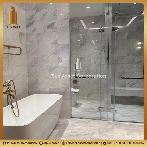 Luxurious modern bathroom with a freestanding bathtub and glass shower enclosure