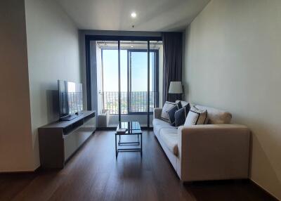 Modern living room with natural light and balcony access