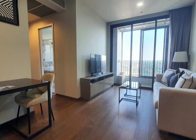 Spacious living room with balcony access and modern furnishings