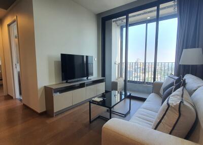 Spacious and well-lit living room with city view