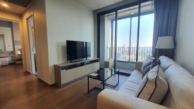 Spacious and well-lit living room with city view