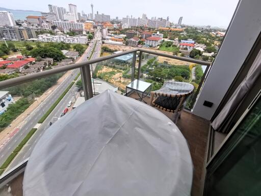 High-angle view of a balcony overlooking a bustling city