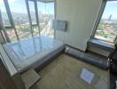 Unfurnished bedroom with a panoramic city view