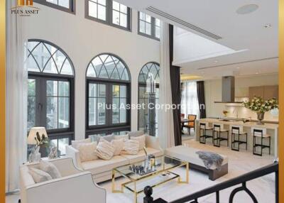 Spacious and elegant living room with large windows and modern decor