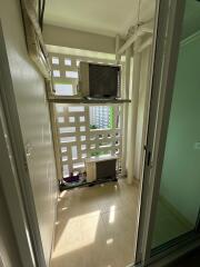 Bright and airy balcony space with louvered walls and city view