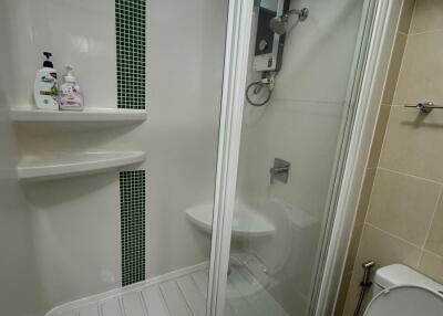 Modern bathroom with enclosed shower and toilet