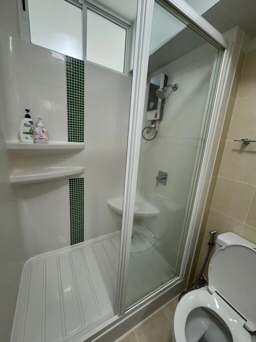 Modern bathroom with enclosed shower and toilet