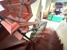 Interior staircase with view into kitchen area