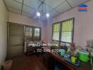 Spacious kitchen with large windows and vintage lighting