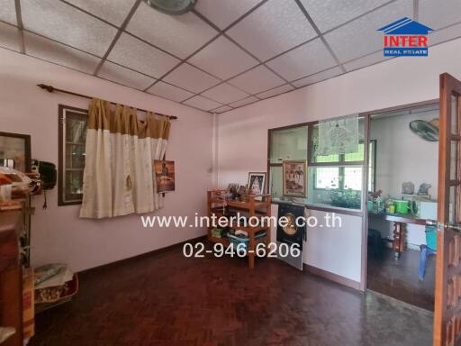 Spacious living room with connected kitchen area