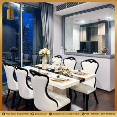 Elegant dining area with modern furniture and city view