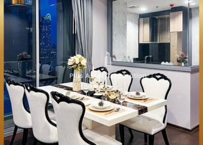 Elegant dining area with modern furniture and city view