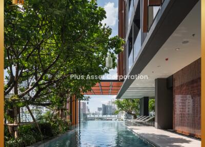 Luxurious outdoor swimming pool adjoining modern residential building