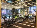 Modern gym facility in residential building with city view