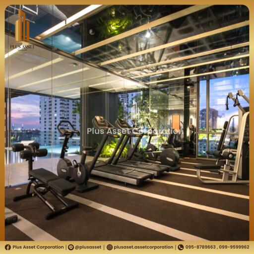 Modern gym facility in residential building with city view