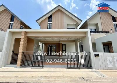 Modern two-story house with balcony and front porch