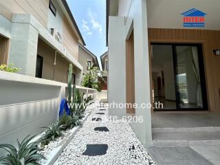 Modern home exterior with landscaped pathway