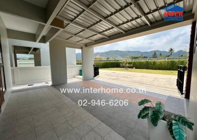 Spacious covered outdoor patio with mountain view