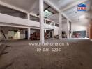 Spacious empty warehouse interior with large pillars