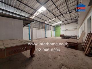 Spacious industrial building interior with skylight roofing