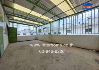 Spacious covered rooftop area with fencing