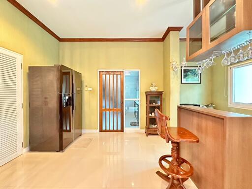 Modern kitchen with a bar counter and refrigerator