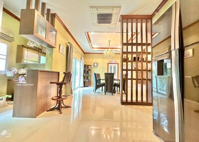 Open plan kitchen and dining area with modern furnishings and decor