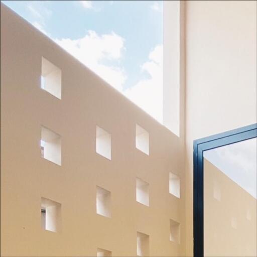 Modern building facade with geometric window pattern